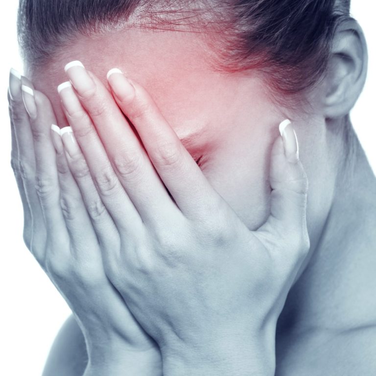 woman with head in hands